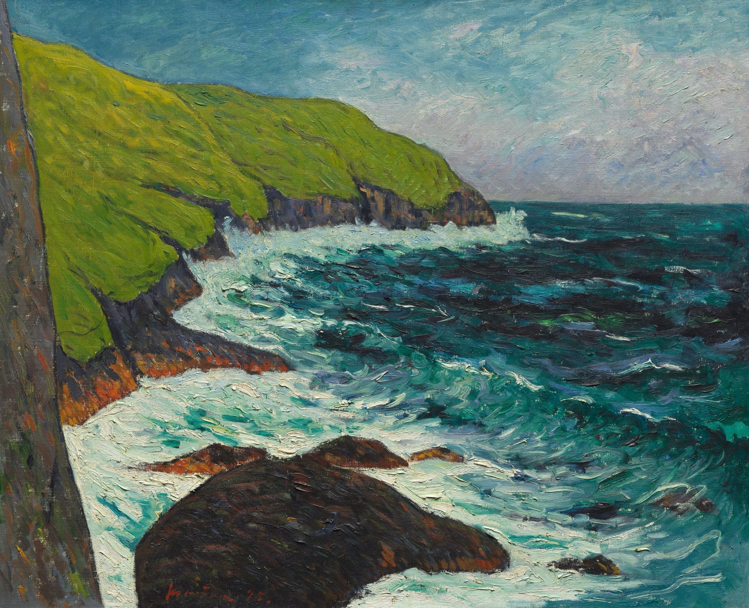 A green headland meets a surging teal sea, with white surf breaking around dark rocks in the foreground.